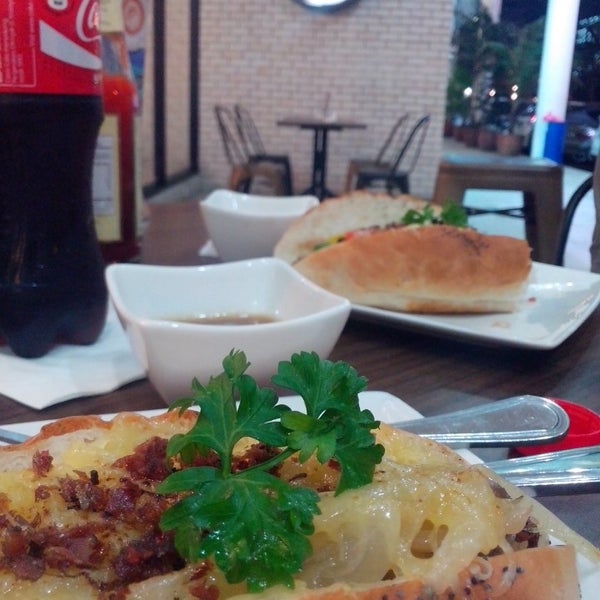 Photo taken at Gourmet Hotdog Cafe by Bassam A. on 1/18/2014