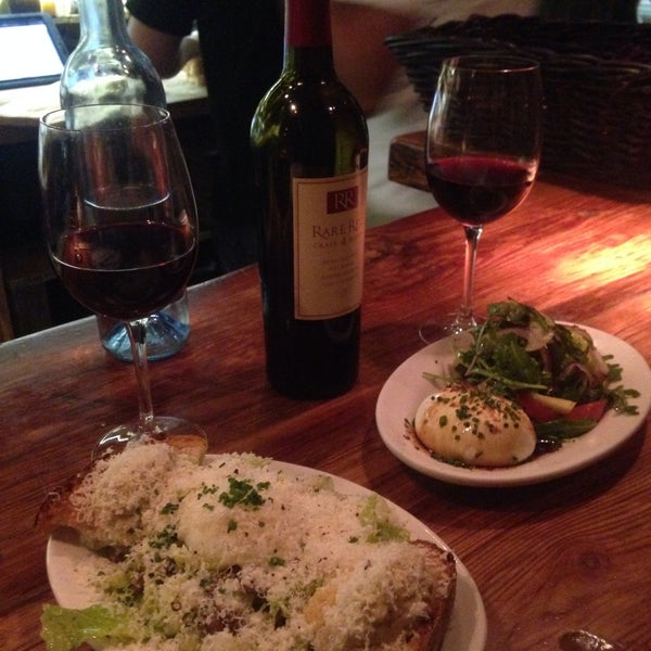 Photo taken at Plancha Tapas and Wine Bar by Ashley D. on 4/17/2015