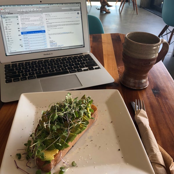 Best avocado toast ever, with a generous drizzle of truffle oil & microgreens.