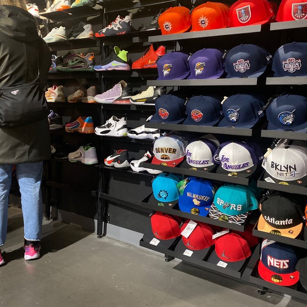 New York, USA. 14th Sep, 2019. Yellow taxis drive past the NBA Store on  Fifth Avenue in Manhattan. The shop carries merchandise of the team of the  National Basketball Association (NBA) and