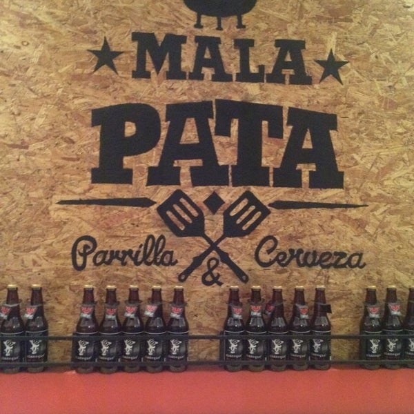 Photo taken at Mala Pata Parrilla y Cerveza by Marco S. on 2/15/2014