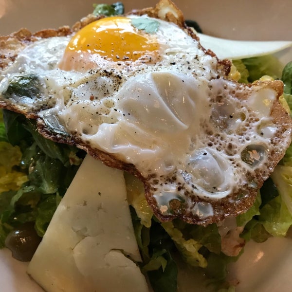 Salad of romaine lettuce, chickpeas, sun dried tomatoes, olives and roasted cauliflower $14, add fried egg $2. Happy hour red, white & bubbly $7 till 7pm.