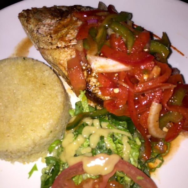 Grilled fish of the day with red pepper sauce and Attleke $22. Live bands on Fridays no cover