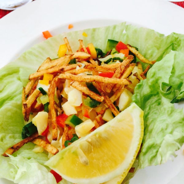 Dine by the beach. Conch salad with diced peppers, lime and guacamole $16.