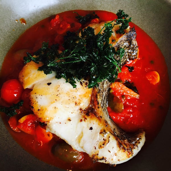 Fish if the day roasted with tomato and olive sauce $28. Roomy space for lunch.