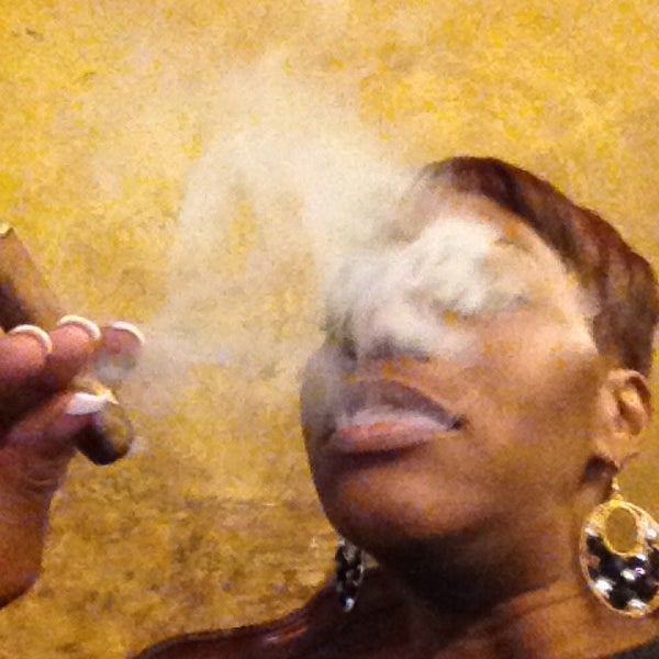 Photo taken at Elite Cigar Cafe by Jasmine S. on 1/1/2013