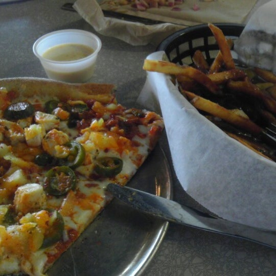 Photo taken at Lighthouse Pizza &amp; Fries by Eric R. on 8/11/2013