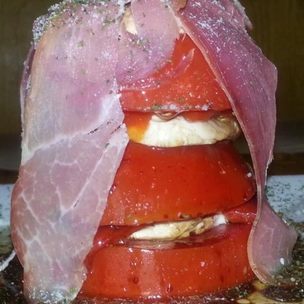 Tomato tower!  Fresh jersey toms, buffalo mozzarella, roasted red peppers and prosciutto ham! Balsamic and olive oil top this tasty treat