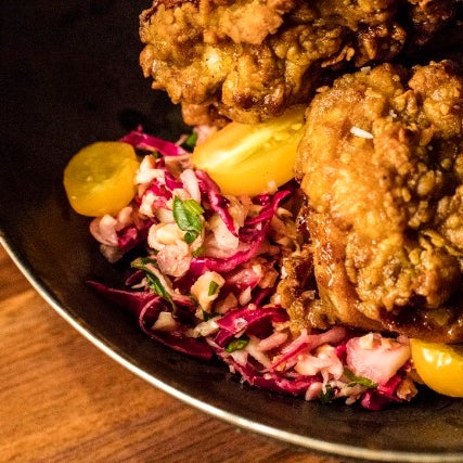 Chef Suvir Saran achieves great success when he's riffing on classic comfort foods, like the Masala Fried Chicken with a thick batter of crunch.