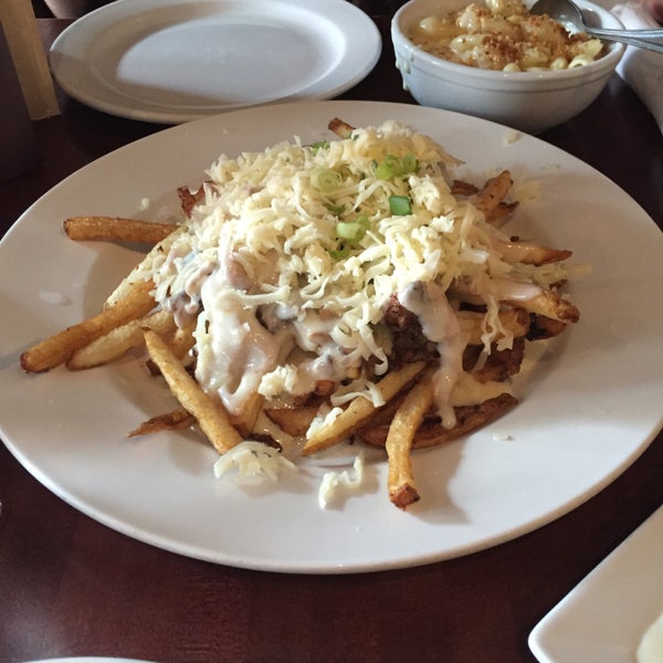 Agree that the smothered fries are a MUST along with the Mac and Cheese. I would say anything with their pulled pork would also be a win! Such good food and service!