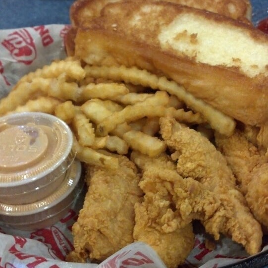 Photo taken at Raising Cane&#39;s Chicken Fingers by Judy N. on 4/20/2013