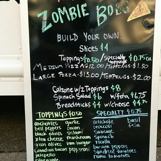 Photo taken at Zombie Bob&#39;s Pizza by Eugene M. on 10/2/2014