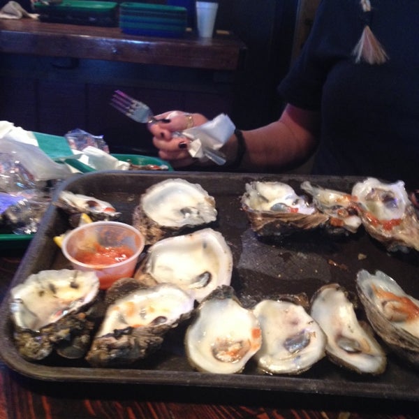 Photo taken at Shuckums Oyster Pub &amp; Grill by Cathy M. on 3/26/2014