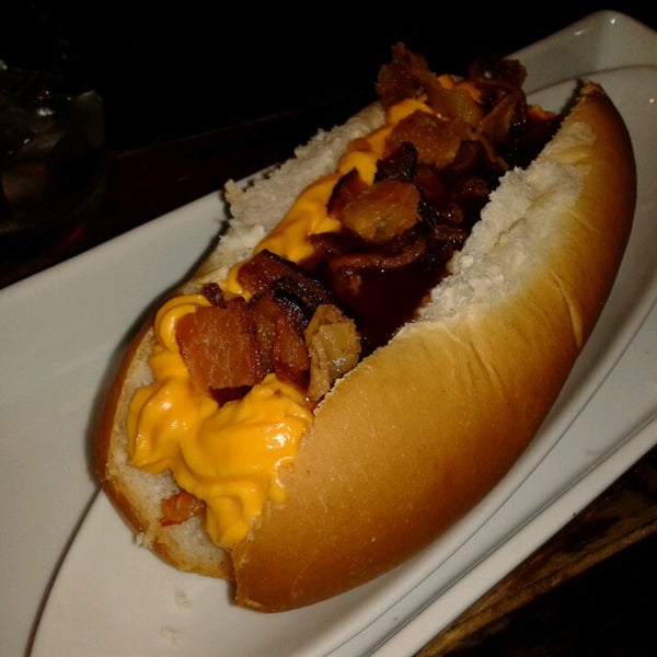 Photo taken at Überdog - Amazing Hot Dogs by Isabela C. on 3/15/2013