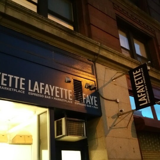 Photo taken at Lafayette Espresso Bar + Marketplace by MK K. on 12/19/2014