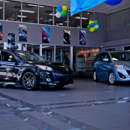 Photo taken at Tom Bush Mazda by Tom Bush Family of Dealerships on 7/24/2013