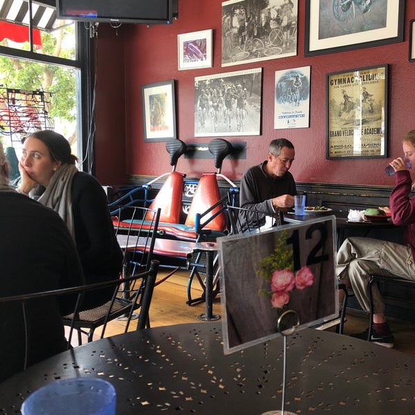 Photo taken at Velo Rouge Cafe by Sam W. on 7/30/2018