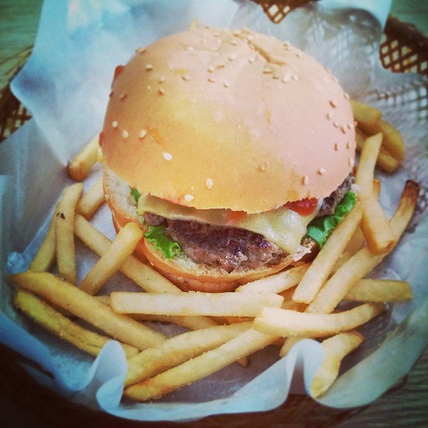 Photo taken at Stuff Over Burger Cafe by Jon J. on 10/7/2014