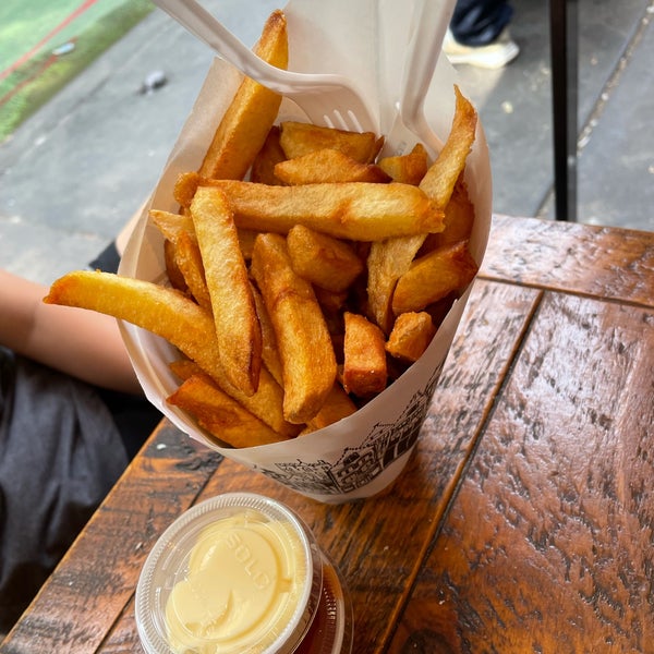 Photo taken at Pommes Frites by Myhong C. on 7/12/2021
