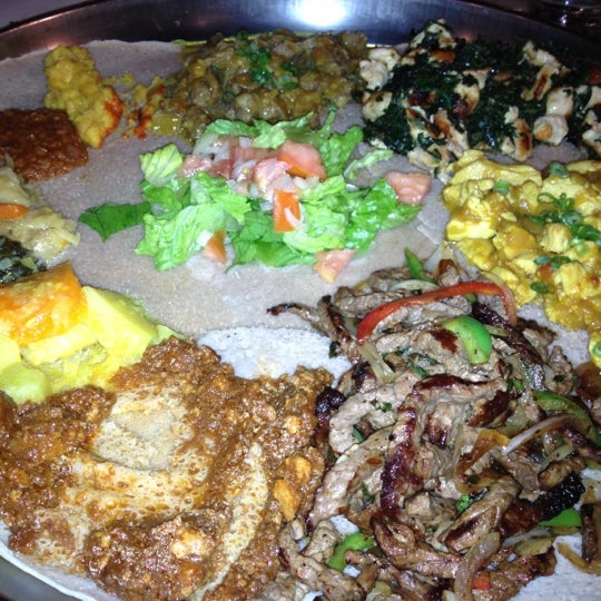 Photo taken at Ethiopian Diamond Restaurant &amp; Bar by Laura C. on 10/10/2012