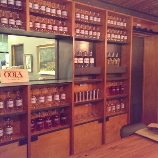Photo taken at OOLA Distillery Bottle Shop by Koos K. on 4/5/2014