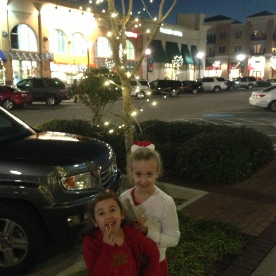 Photo taken at Mayfaire Town Center by Daniel J. on 12/14/2012