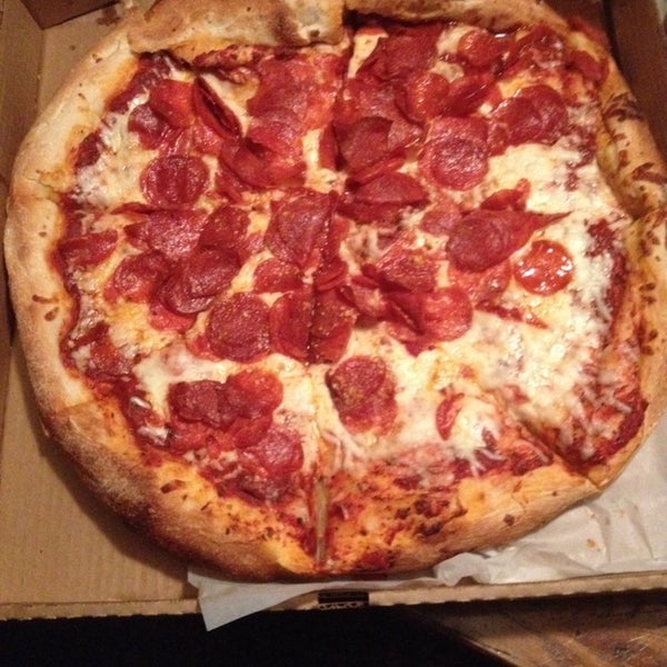 Photo taken at Authentic New York Pizza by Jon S. on 3/25/2014