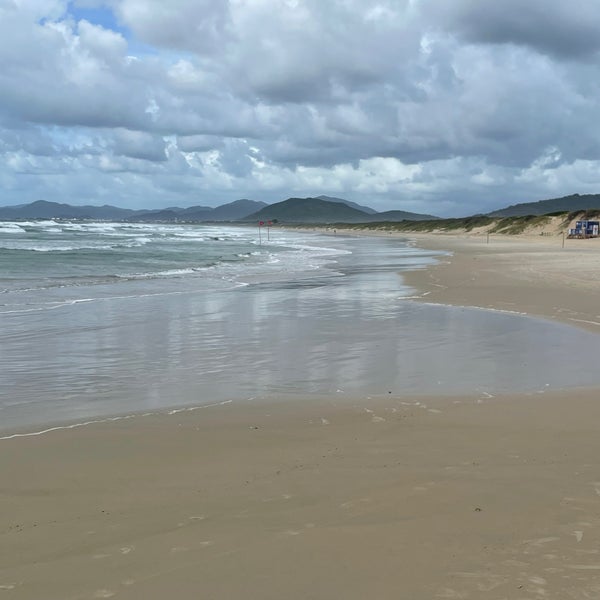 Photo taken at Praia da Joaquina by Michael K. on 1/25/2024