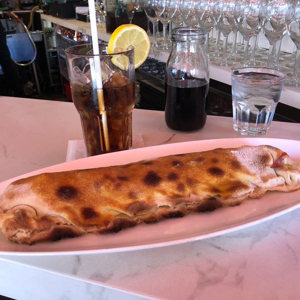 Photo taken at Calzone&#39;s Pizza Cucina by Chris B. on 6/24/2018