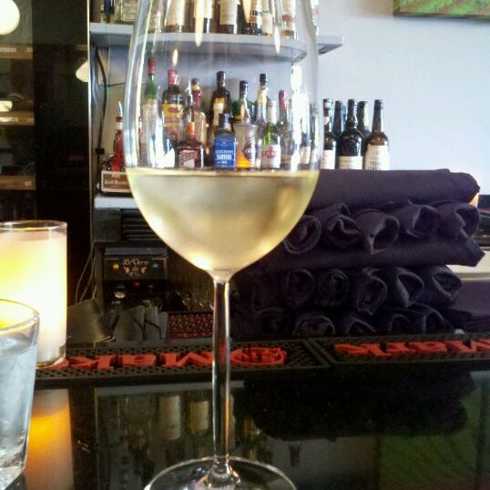 Photo taken at Vinoteca Wine Bar &amp; Bistro by Ford H. on 10/6/2011