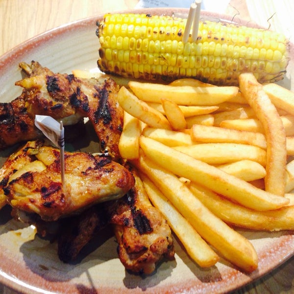 Photo taken at Nando&#39;s by Manasvin O. on 5/2/2015