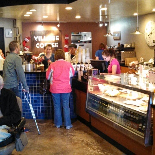 Photo taken at Village Coffee Roastery by Chris N. on 12/7/2013
