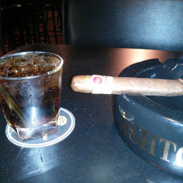 Photo taken at Elite Cigar Cafe by Steve K. on 3/29/2013