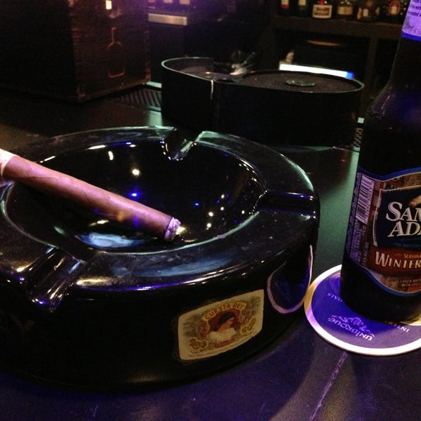 Photo taken at Elite Cigar Cafe by Greg on 1/1/2013