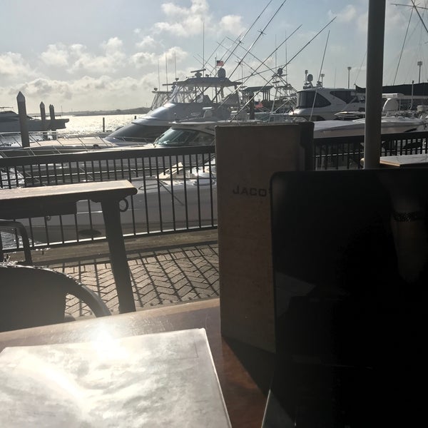 Photo taken at Jaco&#39;s Bayfront Bar &amp; Grille by Caitlin G. on 3/28/2017