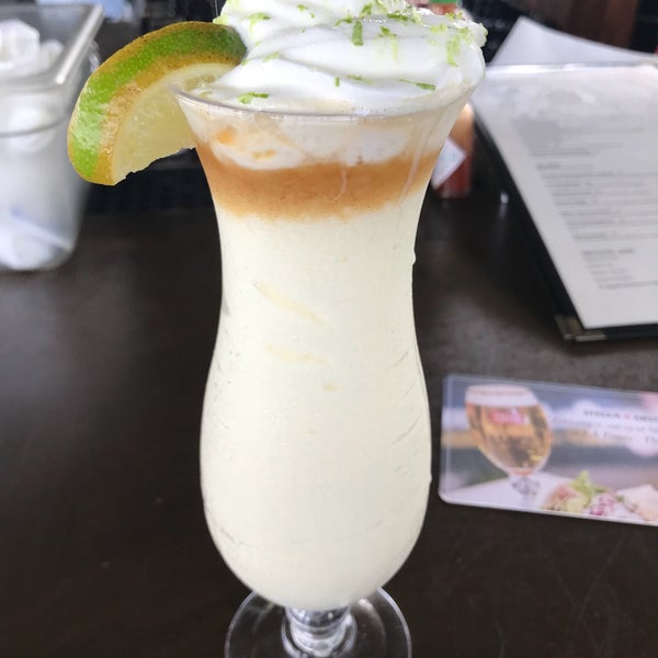 Photo taken at Outriggers Tiki Bar and Grille by Renee D. on 9/4/2018