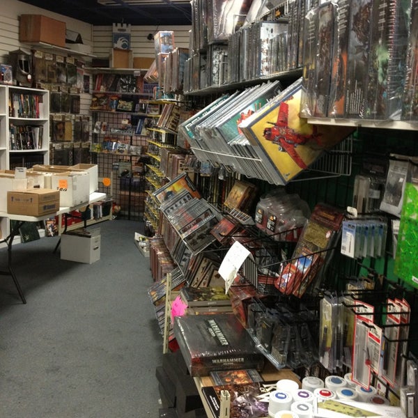 Photo taken at Bosco&#39;s Comics Cards &amp; Games by Mary H. on 12/29/2012