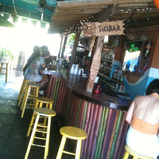 Photo taken at Gilligan&#39;s Island Bar and Grill by Christian Z. on 8/20/2011