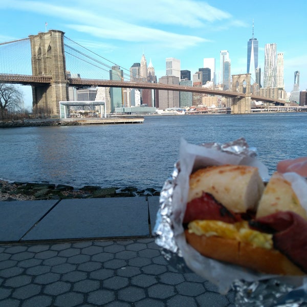 Grab a bagel and eat it in Brooklyn Bridge Park with An awesome view.