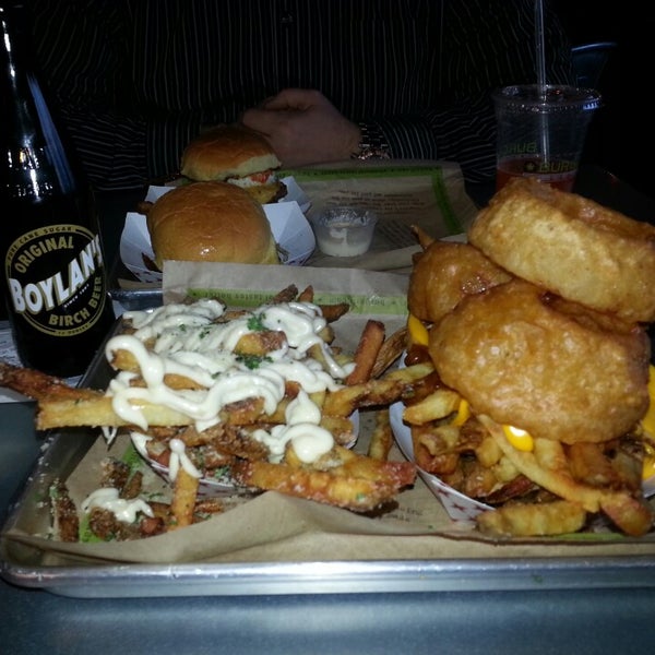 Photo taken at BurgerFi by Alison T. on 2/14/2015