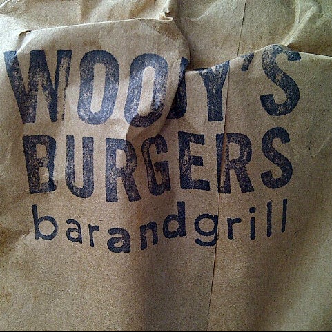 Foto diambil di Woody&#39;s Burgers bar and grill oleh Christine K. pada 3/24/2013
