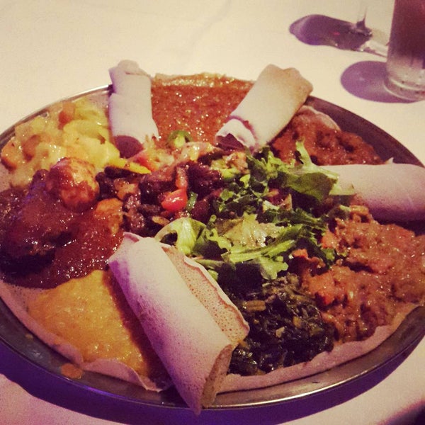 Photo taken at Lucy Ethiopian Restaurant &amp; Lounge by Kale P. on 7/26/2015