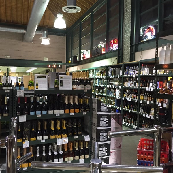 Photo taken at Green Jug Fine Wine &amp; Spirits by Kaye O. on 1/5/2016