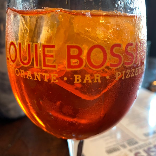 Photo taken at Louie Bossi&#39;s Ristorante Bar Pizzeria by Quin R. on 3/27/2021