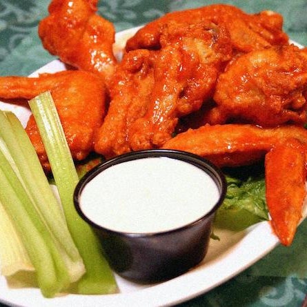 They serve their hot wings mild, hot or extra hot with sauces ranging from BBQ and lemon pepper to house blue cheese or ranch dressing. The spread is classic, with carrots and celery on the side.
