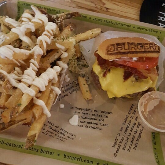 Photo taken at BurgerFi by Christopher J. on 8/24/2015