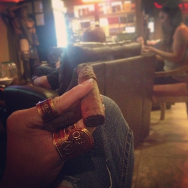 Photo taken at En Fuego Cigars &amp; Lounge by rics on 8/30/2014