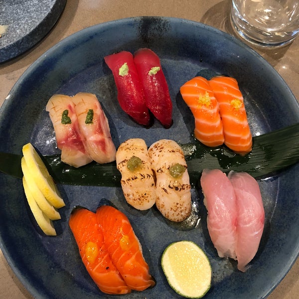 Sit at the sushi bar and go for Omakase / they can tailor the quantity to how hungry you are, but it does come out all at once.