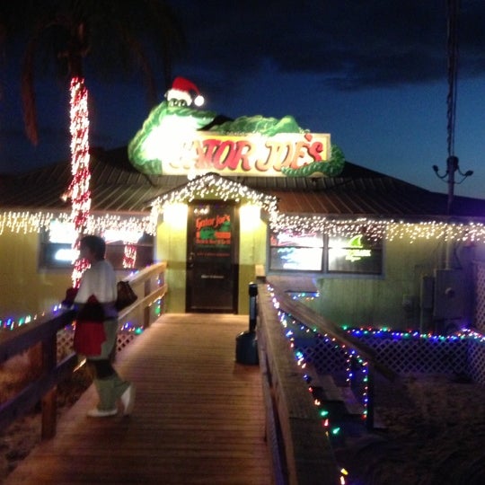 Photo taken at Gator Joe&#39;s Beach Bar &amp; Grill by Genaro V. on 12/15/2012