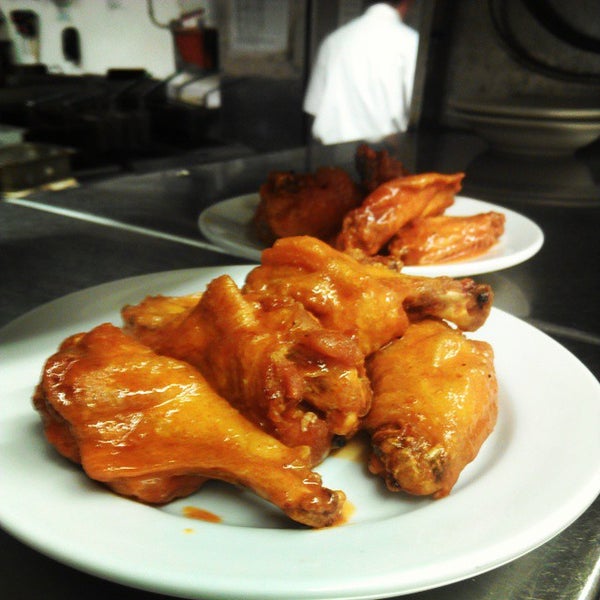 Photo taken at The Crossing Grill &amp; Bar by Crossing Hot Wings on 3/24/2015